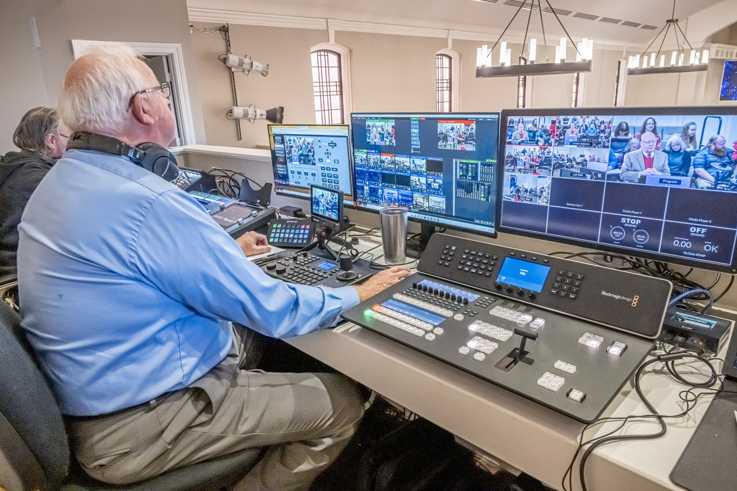 Tommy McDearis reading scripture during the worship service