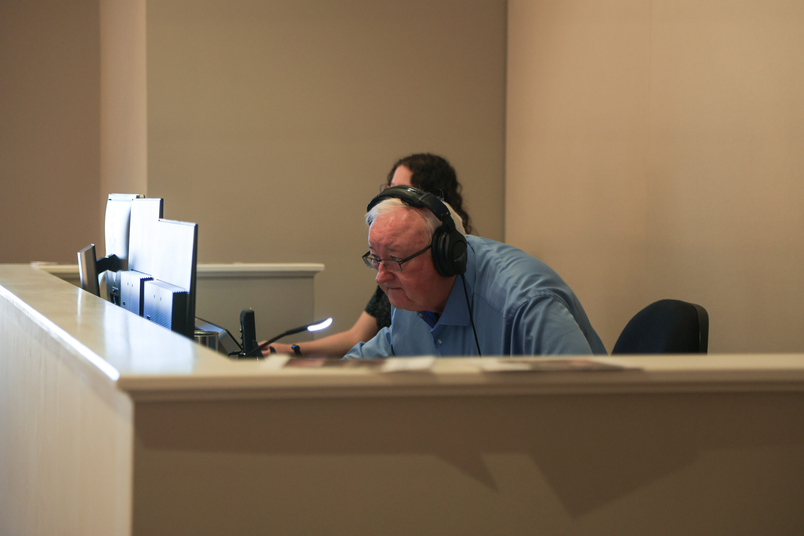 Tommy McDearis reading scripture during the worship service